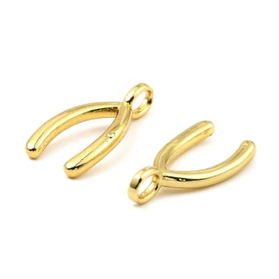 Dije pasador hueso de la suerte 17x8.5 mm latón / unidad