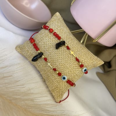 Pulsera protección cruz azabache hilo rojo ajustable / unidad