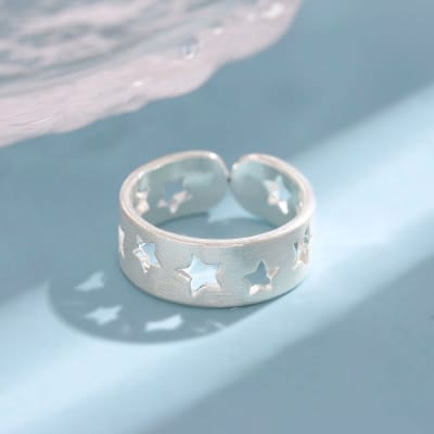 Anillo ajustable estrella calada baño plata / unidad