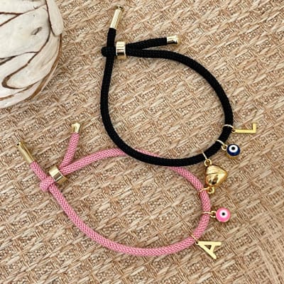 Set de pulseras pareja inicial corazón imantado ojo turco / set