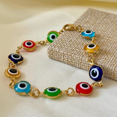 Pulsera protección con ojos turcos nazar grandes en acero dorado / unidad