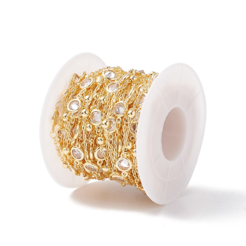 Cadena con balines y punto de luz  baño de oro / metro2