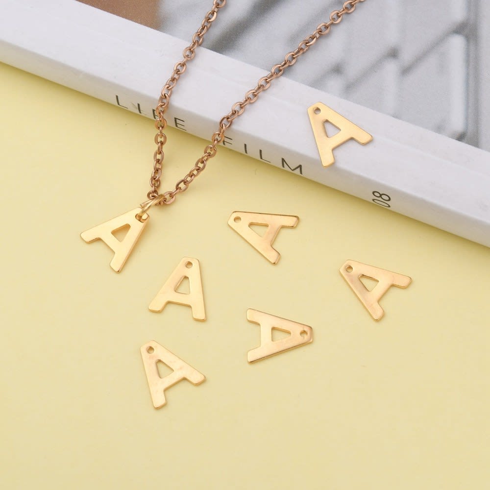 Letras colgantes abecedario 11 mm acero dorado / unidad3
