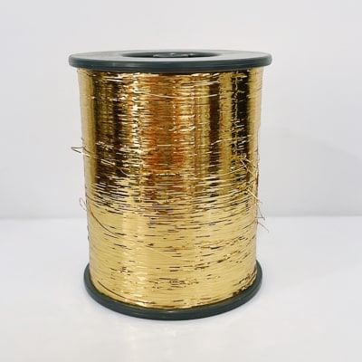 Carrete antiguo cinta nylon dorado1