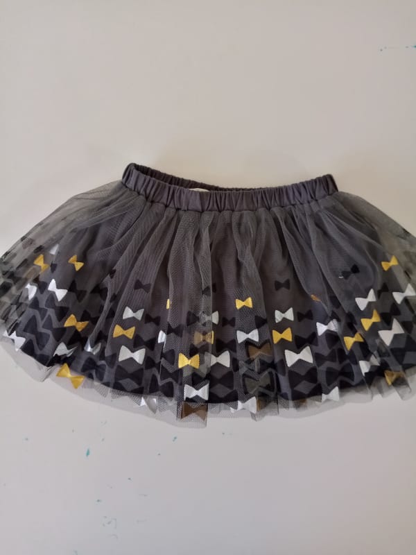 FALDA NIÑA FIRST IMPRESSIONS GRIS