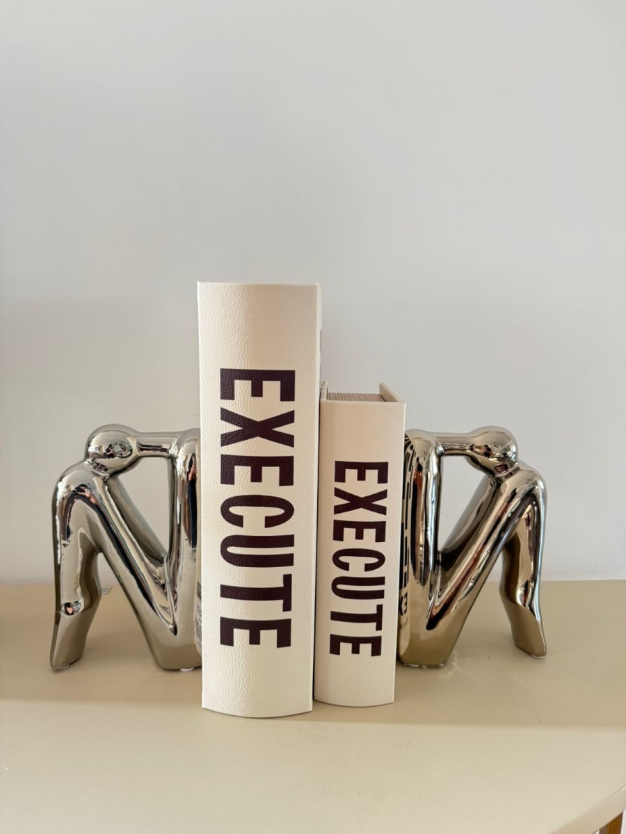 SUJETA LIBROS PAREJA PLATEADO DECOR