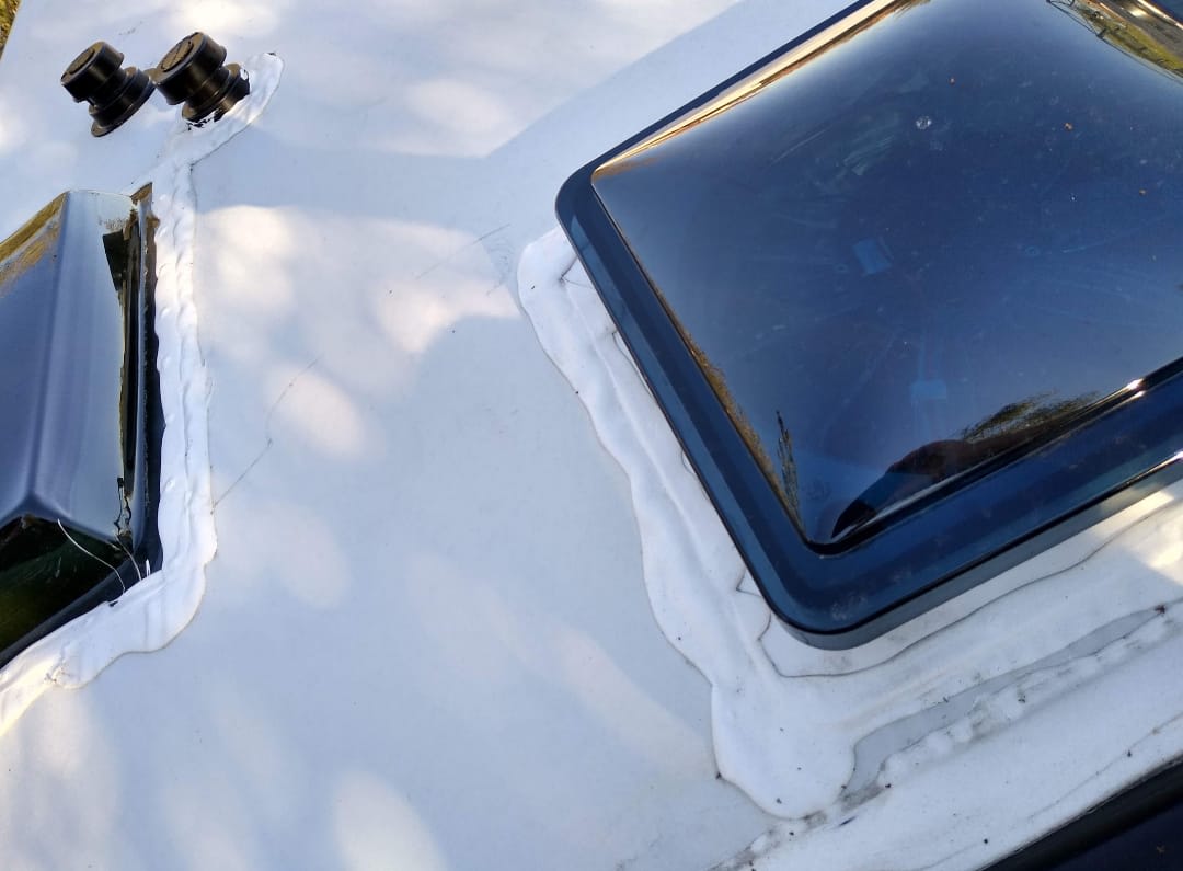 Sealant applied around RV roof penetrations